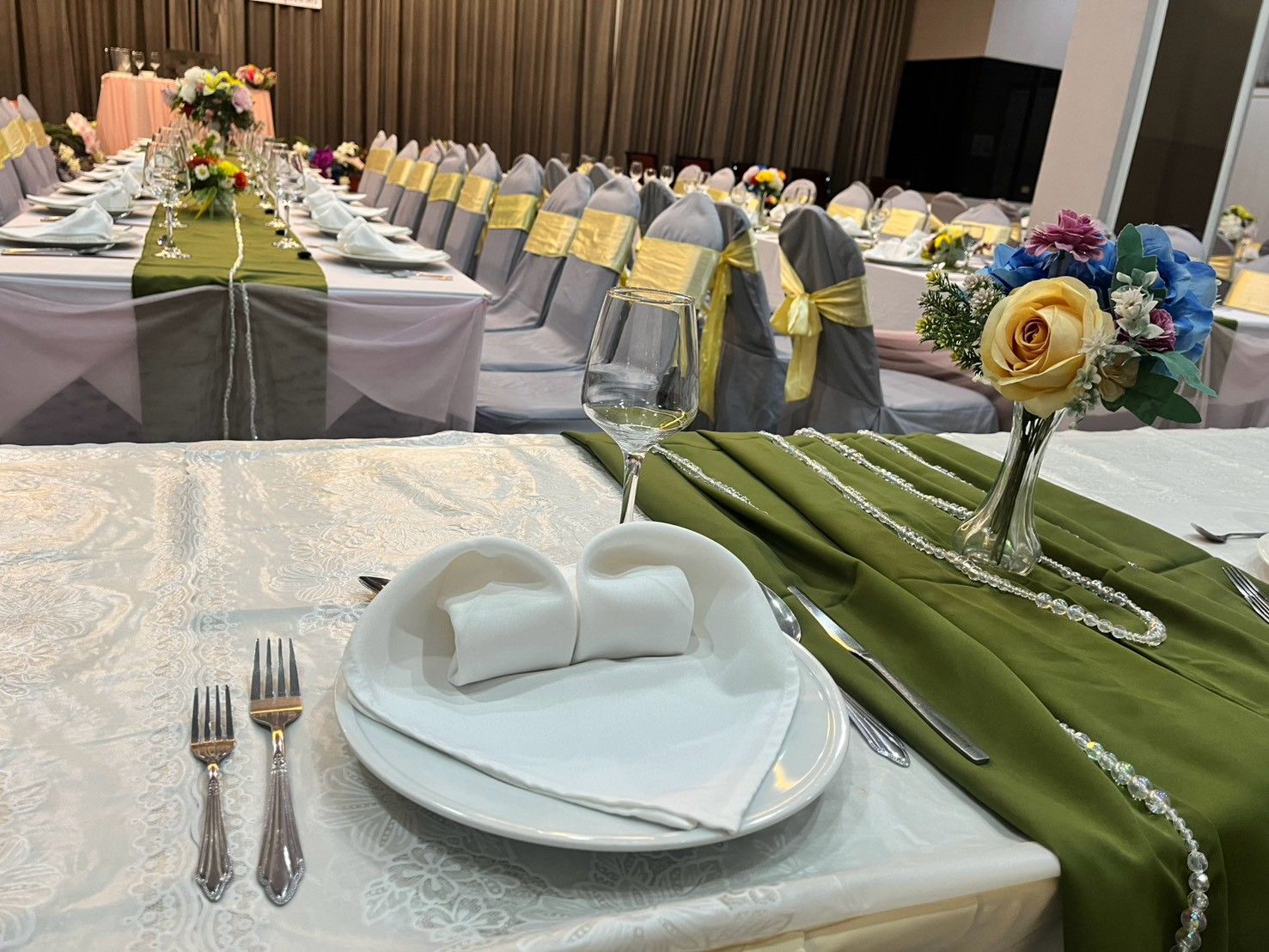 Place setting with folded napkin and silver cutlery