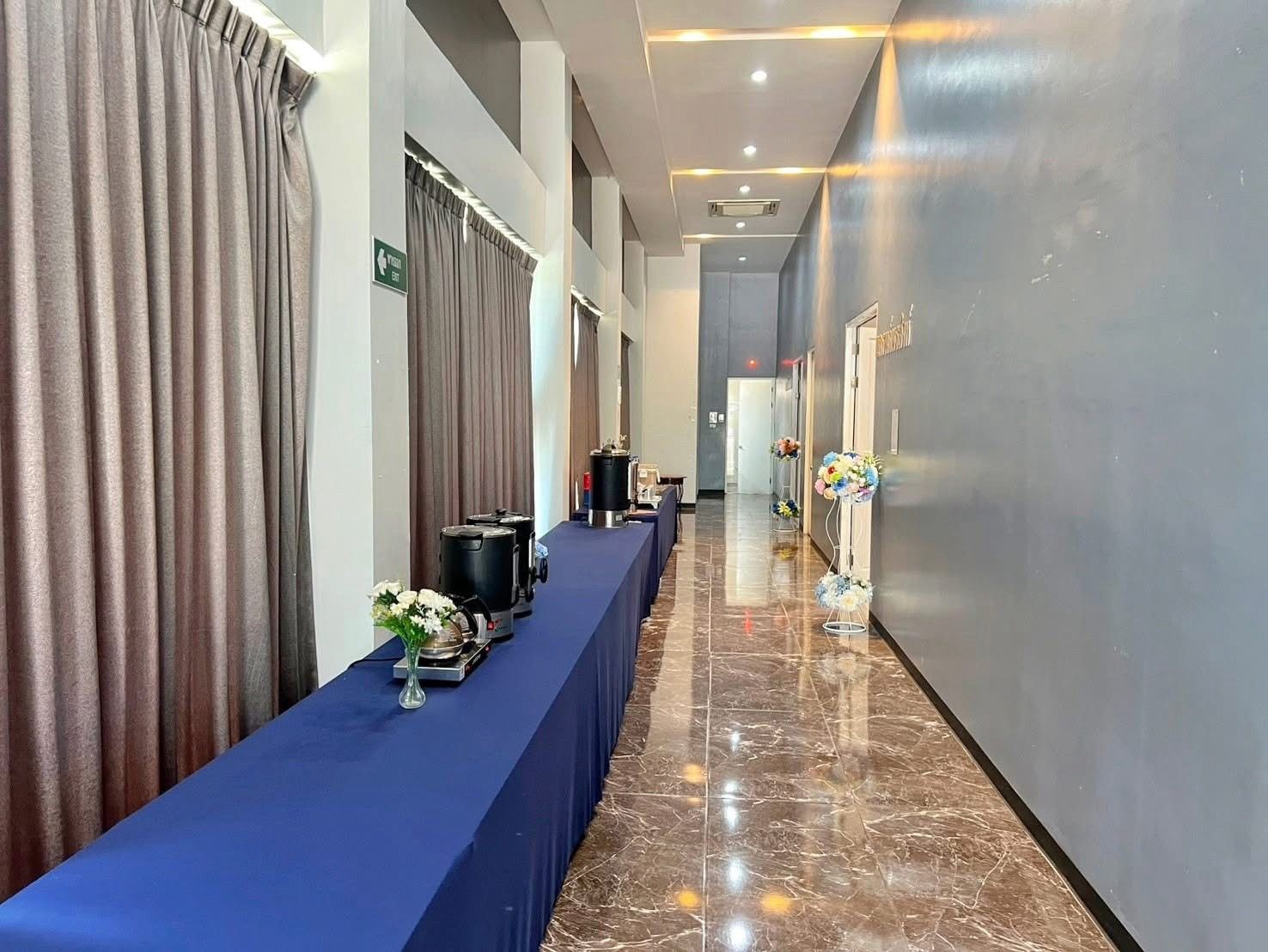 Foyer with refreshment table along the corridor