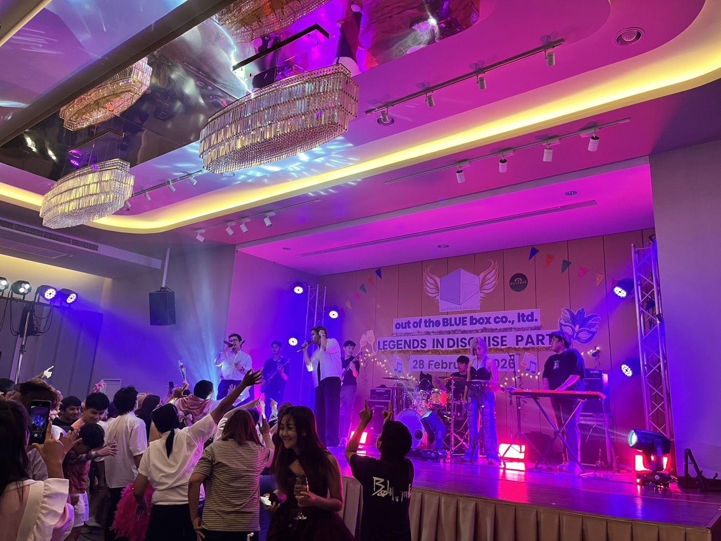 Live band performing at a company party in the ballroom