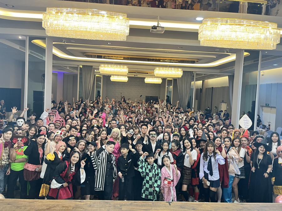 Large group photo of party guests in costume