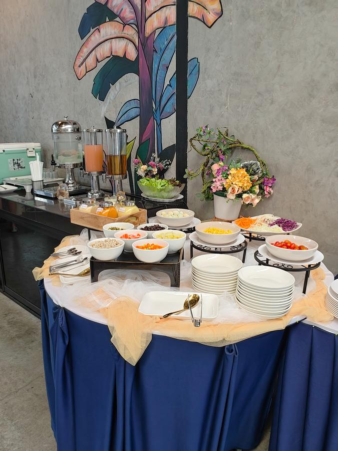 Breakfast buffet with fruit, juices and cereals