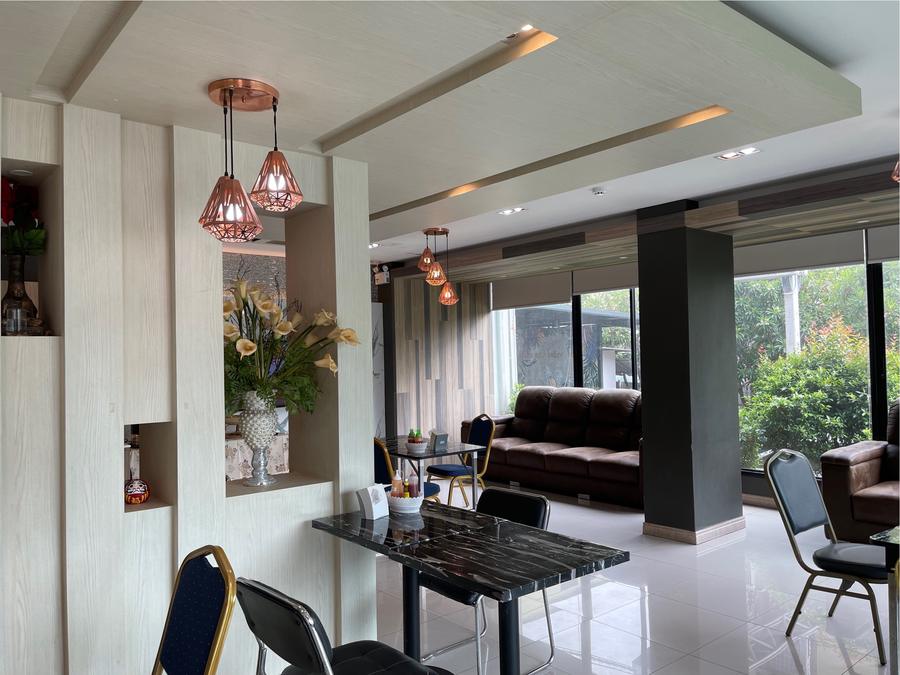 Lobby lounge with leather sofas and copper pendant lights