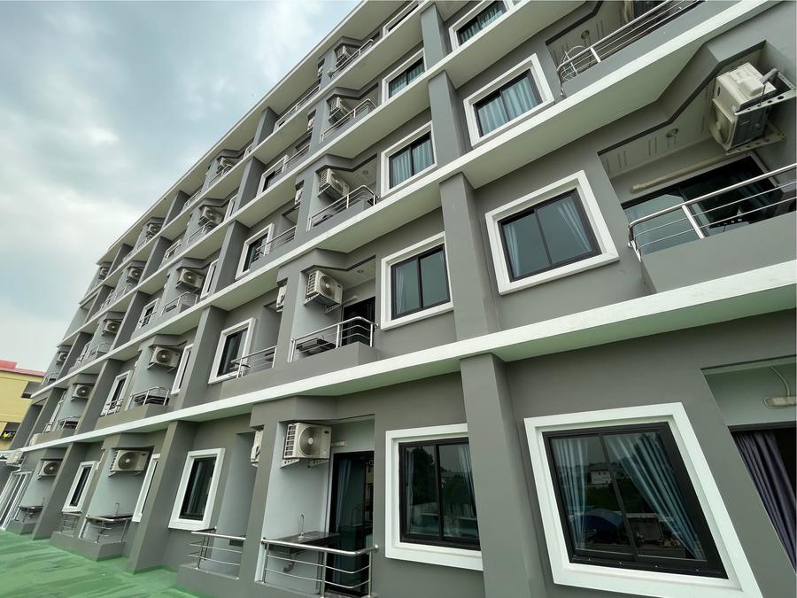 Balconies and windows on the hotel's grey facade