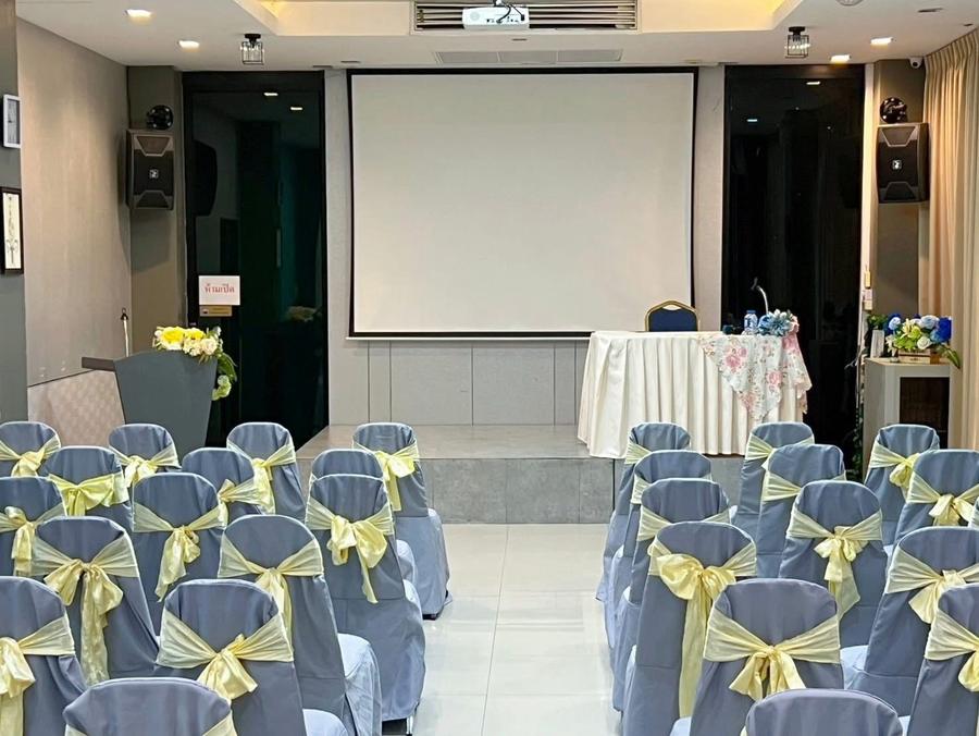 Theatre-style seating facing the projector screen in Norasing 1
