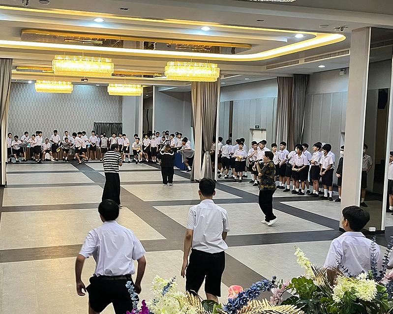 Students taking part in a group activity in the open ballroom