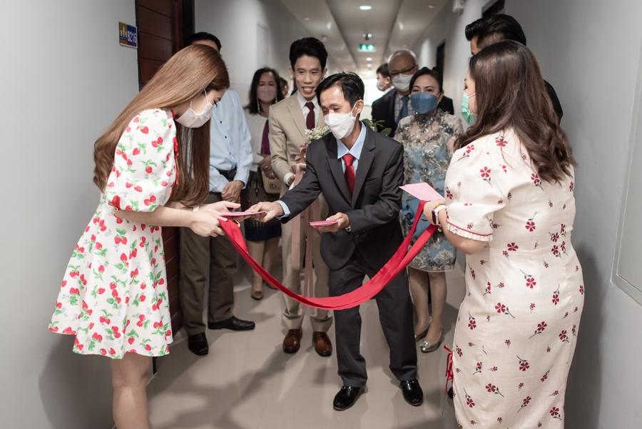 Groom's family passing the ribbon door gate in the corridor