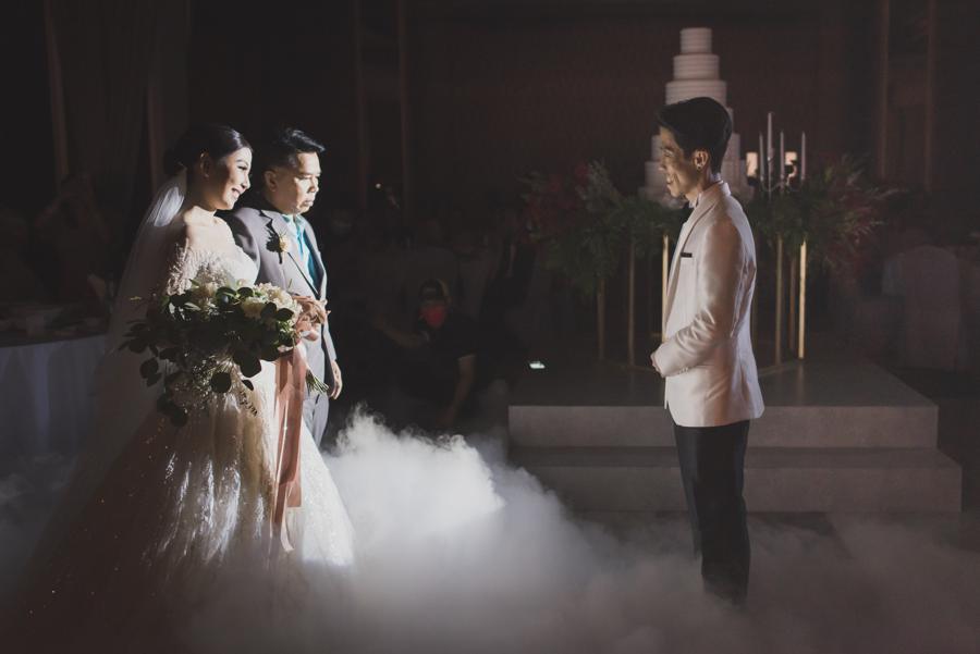 Bride walking in with her father through stage fog