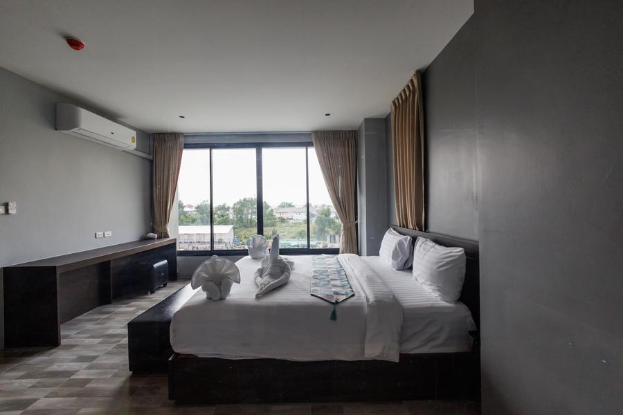 VIP Suite bed with work desk and countryside view