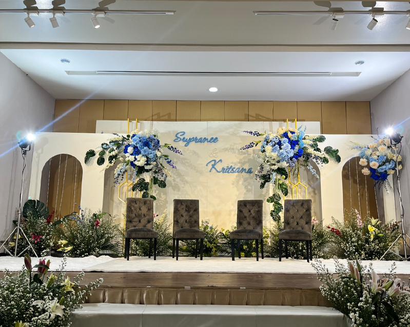 Floral stage backdrop set for the wedding couple